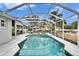 Large screened-in pool with spa and outdoor living area, ideal for relaxation at 214 Bon Vie Pl, Valrico, FL 33594