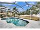 Enclosed swimming pool with a spa area, surrounded by a well-maintained yard at 214 Bon Vie Pl, Valrico, FL 33594