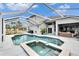 Sparkling pool with attached spa and screened enclosure, perfect for outdoor enjoyment at 214 Bon Vie Pl, Valrico, FL 33594