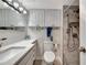 Modern bathroom featuring updated fixtures and tiled shower with bench at 31 Island Way # 303, Clearwater Beach, FL 33767