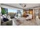 Light, modern living room with large windows, comfortable seating, and stylish decor with a lovely city view at 31 Island Way # 303, Clearwater Beach, FL 33767
