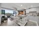 Bright, open-concept living room and kitchen with city view, updated cabinets, tile floors and stainless appliances at 31 Island Way # 303, Clearwater Beach, FL 33767