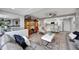 Open floor plan with a living room flowing into a modern white kitchen at 31 Island Way # 303, Clearwater Beach, FL 33767
