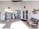 Entrance to the Watergrass Club with double doors and a bench with a gated pool area at 32202 Summerglade Dr, Wesley Chapel, FL 33545