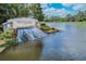 Watergrass community entrance with a cascading waterfall feature and lush landscaping at 32202 Summerglade Dr, Wesley Chapel, FL 33545