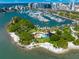 Aerial view of a waterfront park with marina, green spaces, and water activities at 3987 Maceachen Blvd # 133, Sarasota, FL 34233