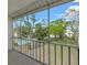 Enjoy the view of the pool and landscaping from this screened balcony at 3987 Maceachen Blvd # 133, Sarasota, FL 34233