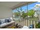 Balcony with seating and a view of the community pool and green space at 3987 Maceachen Blvd # 133, Sarasota, FL 34233