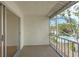 This balcony has a view of the community pool and lush landscaping at 3987 Maceachen Blvd # 133, Sarasota, FL 34233