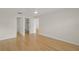 Well-lit bedroom features bamboo floors, ensuite bathroom, and walk-in closet at 3987 Maceachen Blvd # 133, Sarasota, FL 34233