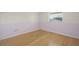 Bedroom featuring bamboo floors, light purple walls, and a window at 3987 Maceachen Blvd # 133, Sarasota, FL 34233