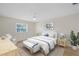 Cozy bedroom with a queen-sized bed, soft rug, and natural light from the window at 3987 Maceachen Blvd # 133, Sarasota, FL 34233