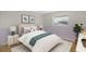 Comfortable bedroom with a bed, soft rug, and natural light from the window at 3987 Maceachen Blvd # 133, Sarasota, FL 34233
