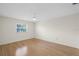 Well-lit bedroom showcases bamboo floors, neutral walls, and a ceiling fan at 3987 Maceachen Blvd # 133, Sarasota, FL 34233
