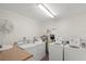 On-site laundry room featuring two washers and two dryers for residents at 3987 Maceachen Blvd # 133, Sarasota, FL 34233
