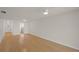 Spacious living room featuring wood flooring and lots of natural light at 3987 Maceachen Blvd # 133, Sarasota, FL 34233