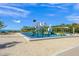 Modern playground with colorful structures and a sandy area at 3987 Maceachen Blvd # 133, Sarasota, FL 34233