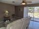 Cozy living room featuring a ceiling fan, comfortable seating, and sliding glass doors at 1229 75Th N Ave, St Petersburg, FL 33702