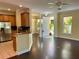 Inviting living space flows from kitchen with stainless appliances to the dining area at 130 Banyan Bay Dr, St Petersburg, FL 33705