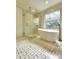 Modern bathroom featuring a frameless glass shower, freestanding tub, and elegant tile work, offering a spa-like retreat at 19018 Geraci Rd, Lutz, FL 33548