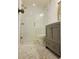 Bathroom featuring a modern vanity and glass shower with designer tile at 19018 Geraci Rd, Lutz, FL 33548