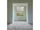 Bedroom with a window providing a view of wooded backyard at 19018 Geraci Rd, Lutz, FL 33548