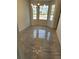 Bright dining room with large windows, modern lighting, and neutral colored walls at 19018 Geraci Rd, Lutz, FL 33548