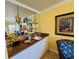 Charming wet bar area with mirrored backsplash, granite countertop, and ample cabinet space at 19417 Gulf Blvd # C210, Indian Shores, FL 33785