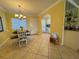 Bright dining area with tile floors, pendant lighting, and an open view to the kitchen at 19417 Gulf Blvd # C210, Indian Shores, FL 33785