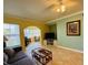 Cozy living room with comfortable seating, a TV, and plenty of natural light at 19417 Gulf Blvd # C210, Indian Shores, FL 33785