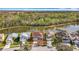 Scenic aerial of home near a pond and trees, shown with a red outline at 27500 Breakers Dr, Wesley Chapel, FL 33544