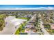 Aerial view showcases the home's lake view with well-manicured lawns and a cozy community at 27500 Breakers Dr, Wesley Chapel, FL 33544