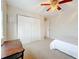 Bedroom featuring a ceiling fan, carpet flooring, and closet at 27500 Breakers Dr, Wesley Chapel, FL 33544