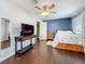 Bright bedroom with a comfortable bed, console table, and stylish decor at 27500 Breakers Dr, Wesley Chapel, FL 33544