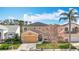 A view of the home showcasing its manicured lawn, and a palm tree at 27500 Breakers Dr, Wesley Chapel, FL 33544