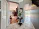 Hallway showcasing a seamless transition into the living room and a view of the backyard at 27500 Breakers Dr, Wesley Chapel, FL 33544