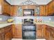Updated kitchen offers granite counters, double oven and decorative backsplash at 27500 Breakers Dr, Wesley Chapel, FL 33544