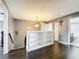 Stylish living area with hardwood floors, custom built-in shelving, and neutral gray paint at 27500 Breakers Dr, Wesley Chapel, FL 33544