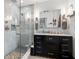 Bathroom featuring glass enclosed shower and dark wood vanity with marble countertop at 3333 San Bernadino St, Clearwater, FL 33759