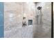 Luxurious walk-in shower with custom tile work, a rainfall showerhead, and sleek fixtures at 3333 San Bernadino St, Clearwater, FL 33759