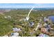 This aerial view showcases the home's location among lush greenery and neighborhood at 9050 San Martin Ne Blvd, St Petersburg, FL 33702