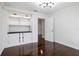 Bonus room with built-in shelving and dark wood floors at 9050 San Martin Ne Blvd, St Petersburg, FL 33702