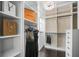Spacious, organized walk-in closet with custom shelving and chandelier at 9050 San Martin Ne Blvd, St Petersburg, FL 33702