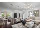 Spacious living room with hardwood floors, lots of natural light and stairs to the second floor at 9050 San Martin Ne Blvd, St Petersburg, FL 33702