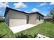 Open patio and freshly cut lawn located in the backyard of this cozy home at 10019 N Hyaleah, Tampa, FL 33617