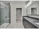 Modern bathroom featuring a glass shower enclosure, tile, and entry to walk-in closet at 10019 N Hyaleah, Tampa, FL 33617