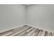 Neutral bedroom with gray wood-look floors and modern baseboards at 10019 N Hyaleah, Tampa, FL 33617