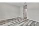 Spacious bedroom featuring gray-toned wood-look flooring and neutral color palette at 10019 N Hyaleah, Tampa, FL 33617