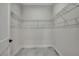 Walk-in closet with wire shelving and neutral tile flooring at 10019 N Hyaleah, Tampa, FL 33617