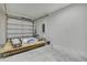 Spacious garage with a roll-up door, ample storage, and bare concrete floors at 10019 N Hyaleah, Tampa, FL 33617